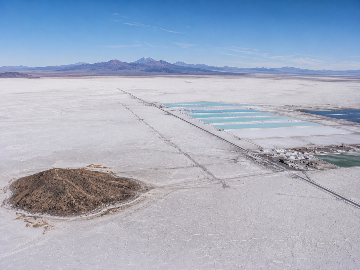 Salar de Uyuni salt flat with lithium extraction infrastructure visible in the Bolivian landscape.