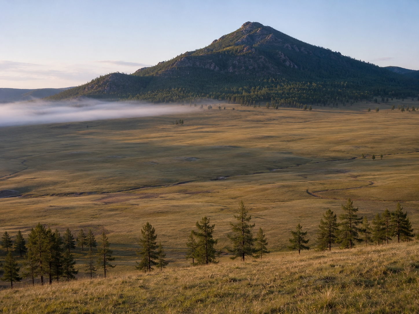 The remote Burkhan Khaldun landscape associated with traditions about Genghis Khan's burial.