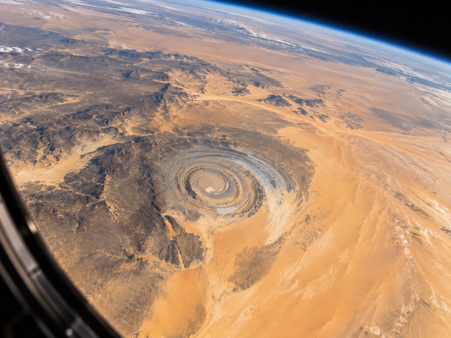 : The Richat Structure appears as a giant circular pattern in the Sahara when viewed from low Earth orbit.